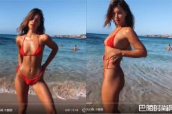 女模海滩耍性感 啤酒肚大叔路过露神秘笑容爆红